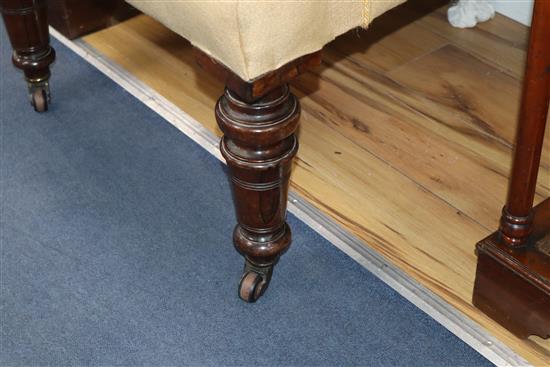 A Victorian rosewood upholstered wing armchair